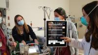 Four doctors conducting an ECMO consult